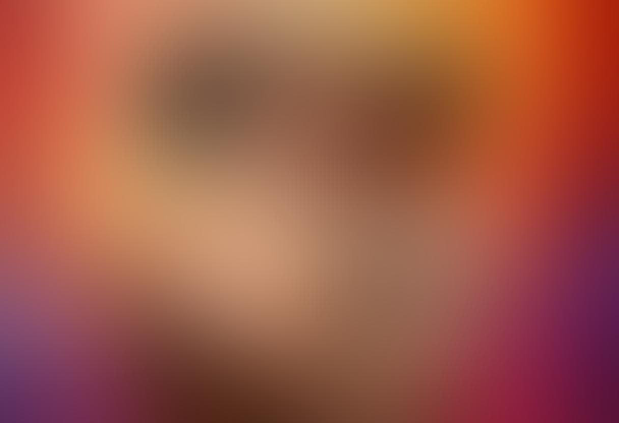 A vibrant and evocative scene showcasing the intimacy between two male figures, entwined in an embrace that captures emotional depth and sensuality. The background is a soft gradient of warm colors, enhancing the atmosphere of passion and connection. Include abstract elements symbolizing desire and exploration, such as flowing lines or swirling patterns. The overall mood is romantic and artistic, inviting viewers into the world of sensual gay imagery. super-realistic. vibrant colors. soft focus.